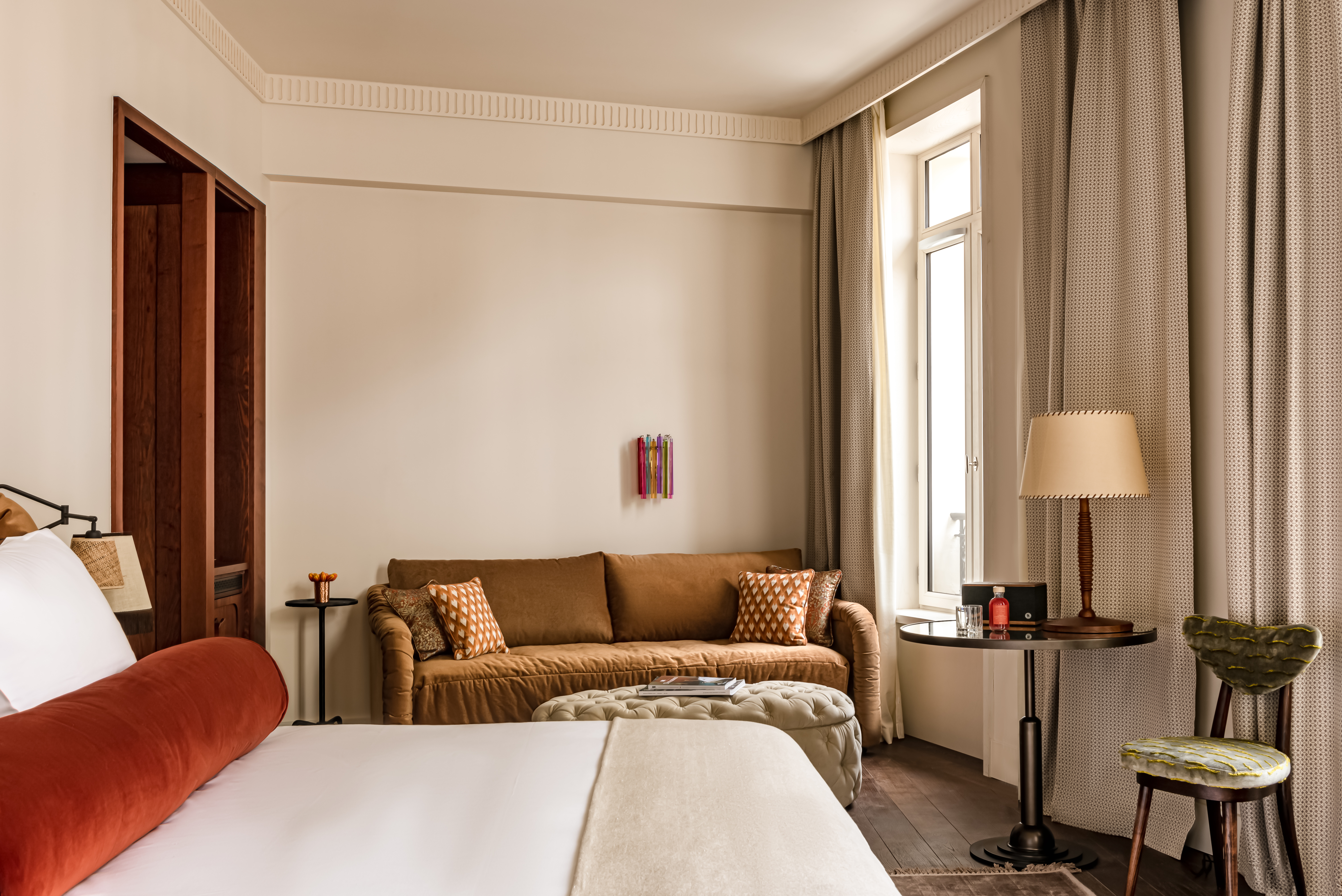 Chateau des Fleurs Superior room with double bed, neutral tones, and sitting area