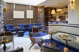 Hotel Bel Ami Paris blue charis and chrome in a wooden lined bar