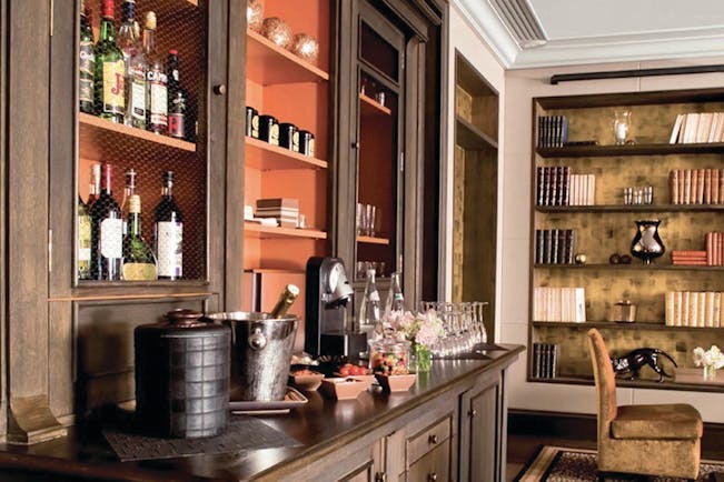 Hotel Esprit Saint Germain Paris complimentary bar area with bottles and coffee machine