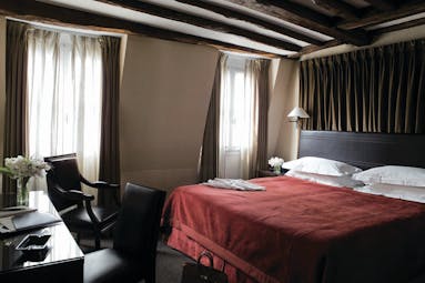 Hotel Esprit Saint Germain Paris deluxe bedroom with dark wooden desk and chair
