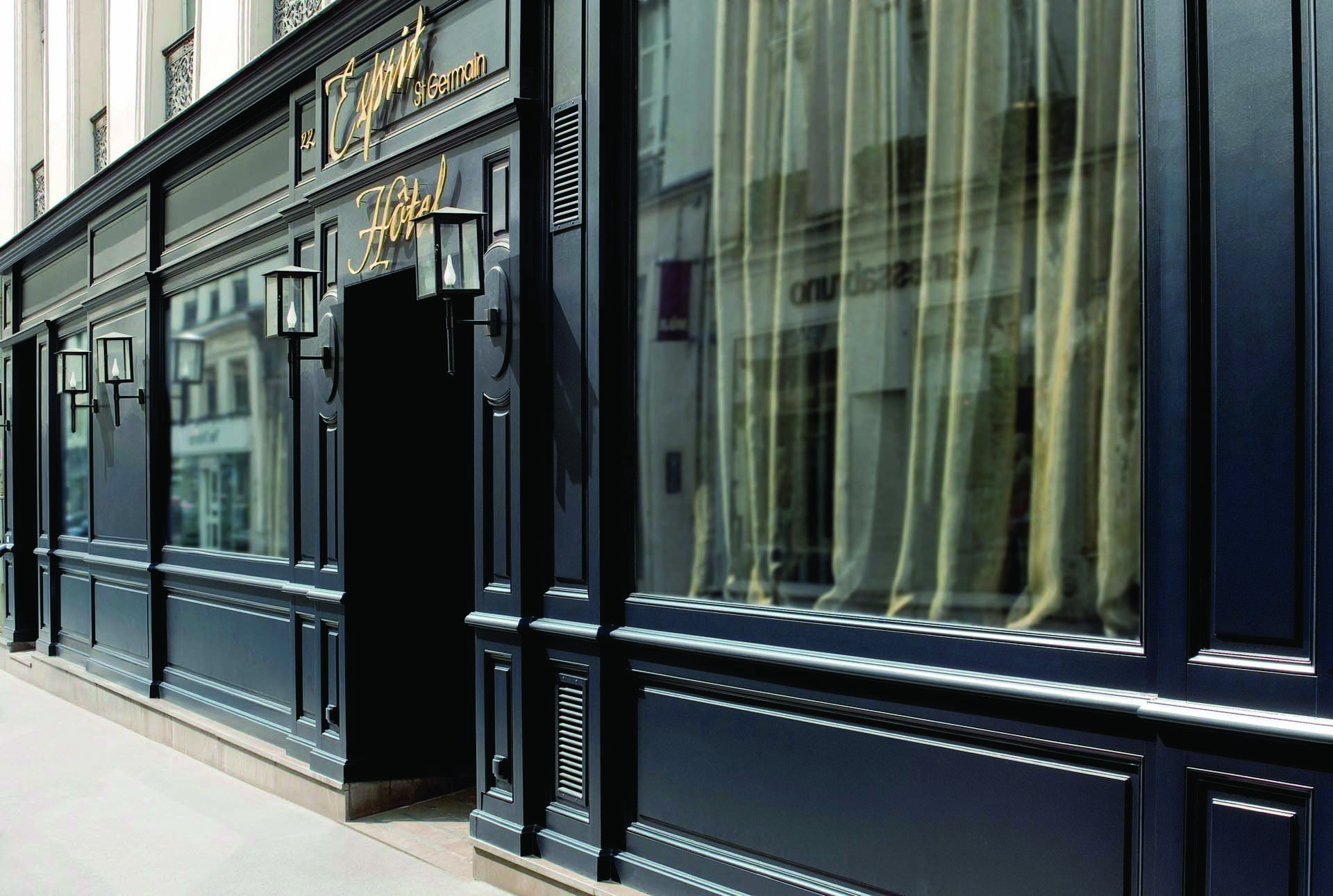 Hotel Esprit Saint Germain Paris entrance dark fronted hotel with a sign reading 'Esprit Saint Germain'