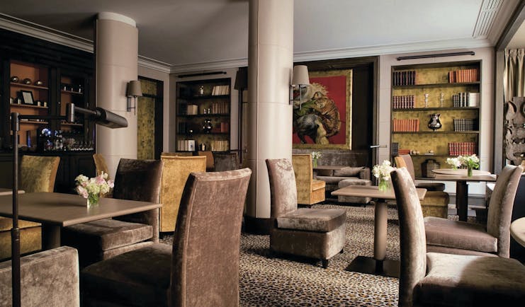 Hotel Esprit Saint Germain Paris library lounge with animal print carpet and large painting of a tiger 