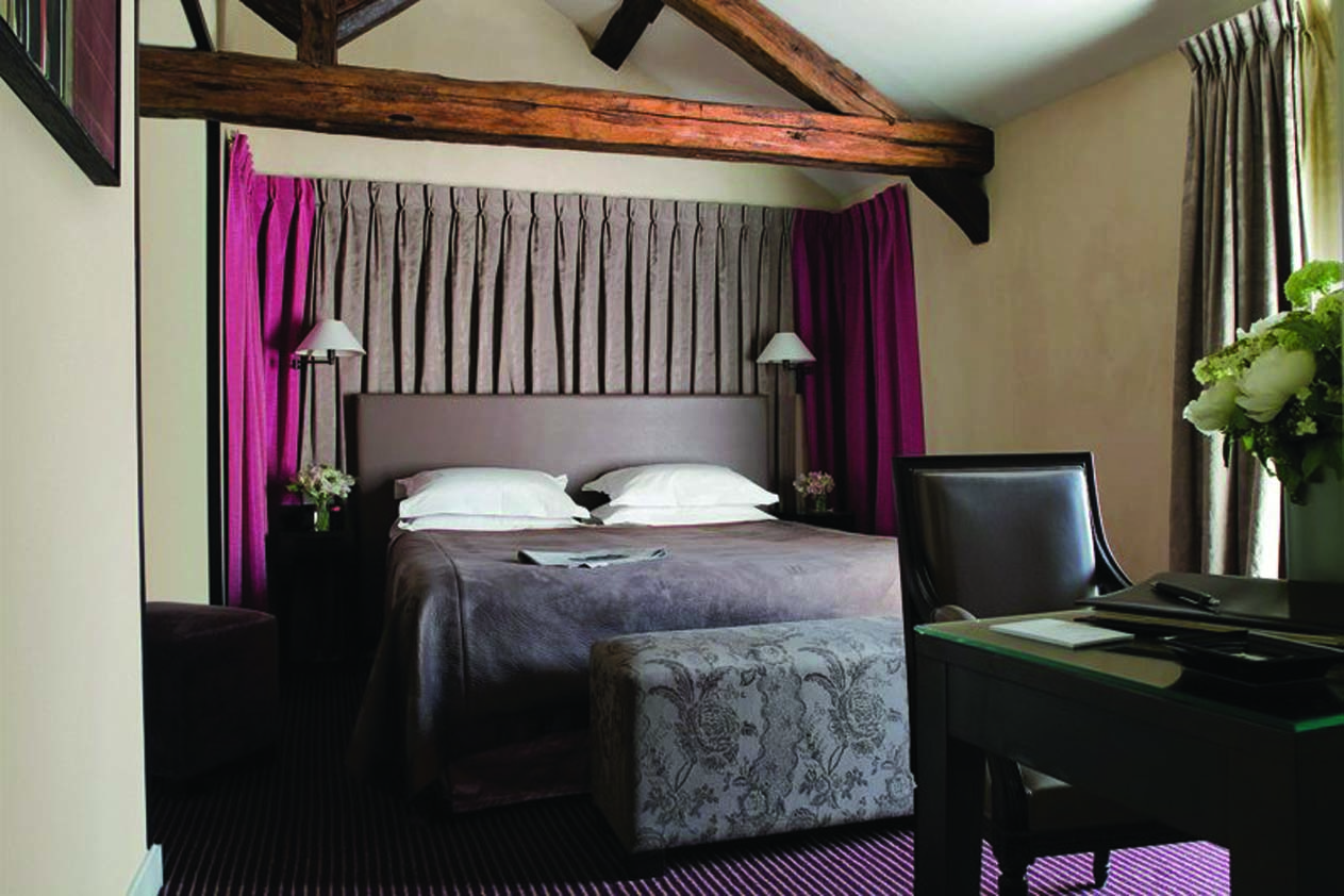 Hotel Esprit Saint Germain Paris prestige bedroom terrace exposed beams and a desk with a leather chair