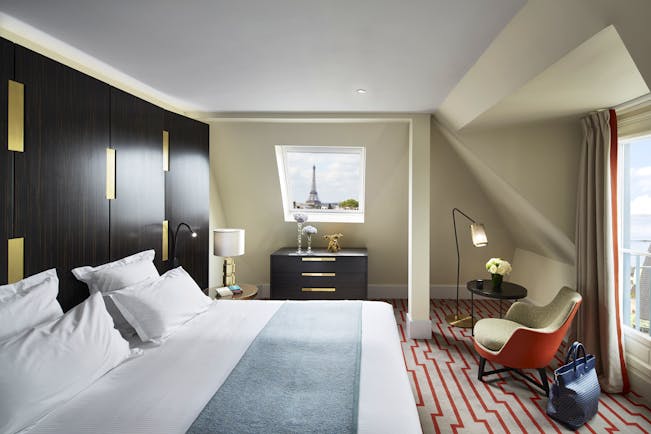 Hotel Montalembert bedroom with sloping ceiling and view