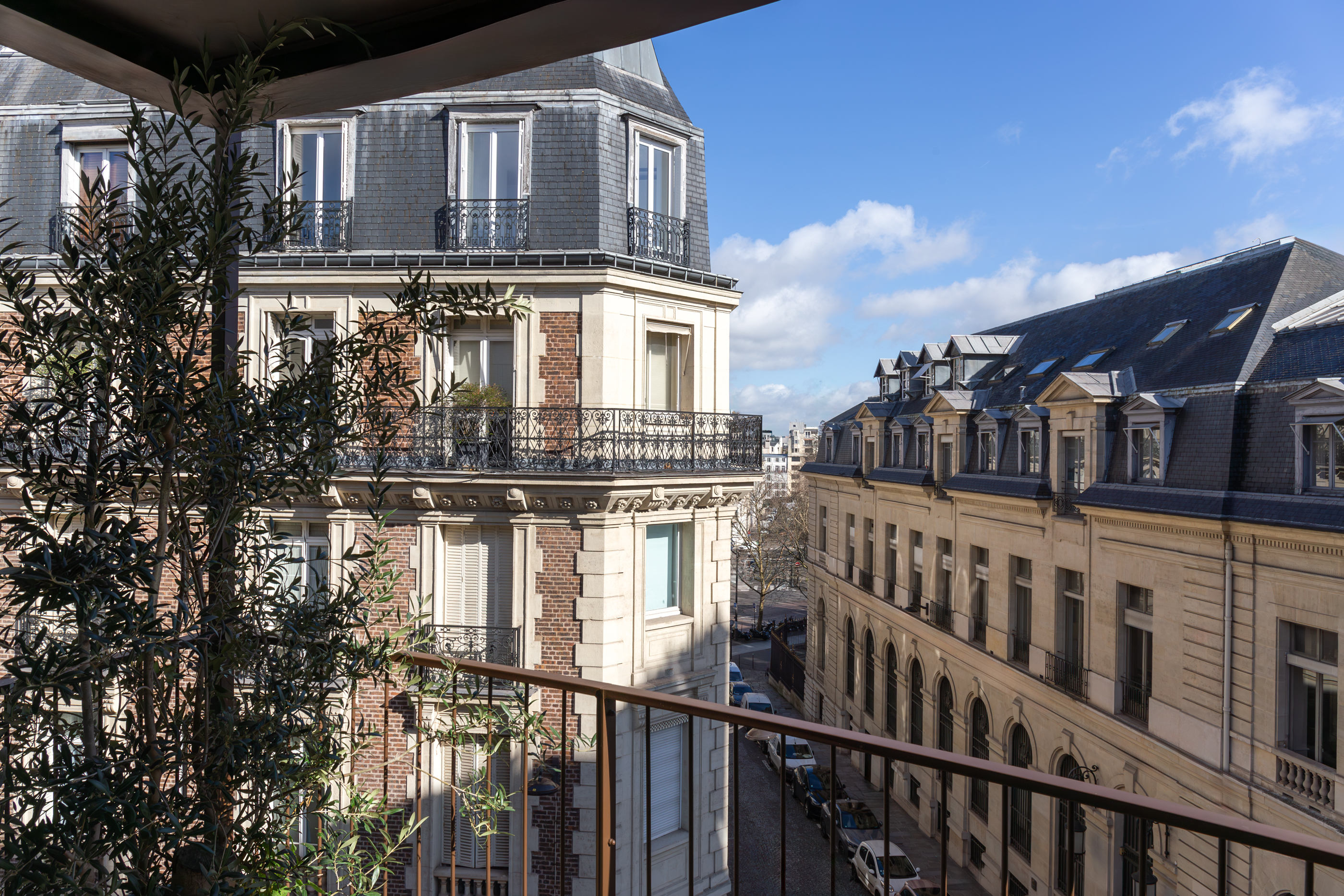 Hotel Norman view from one of the room balconies, showing a classic Parisian street with tall ornate buildings