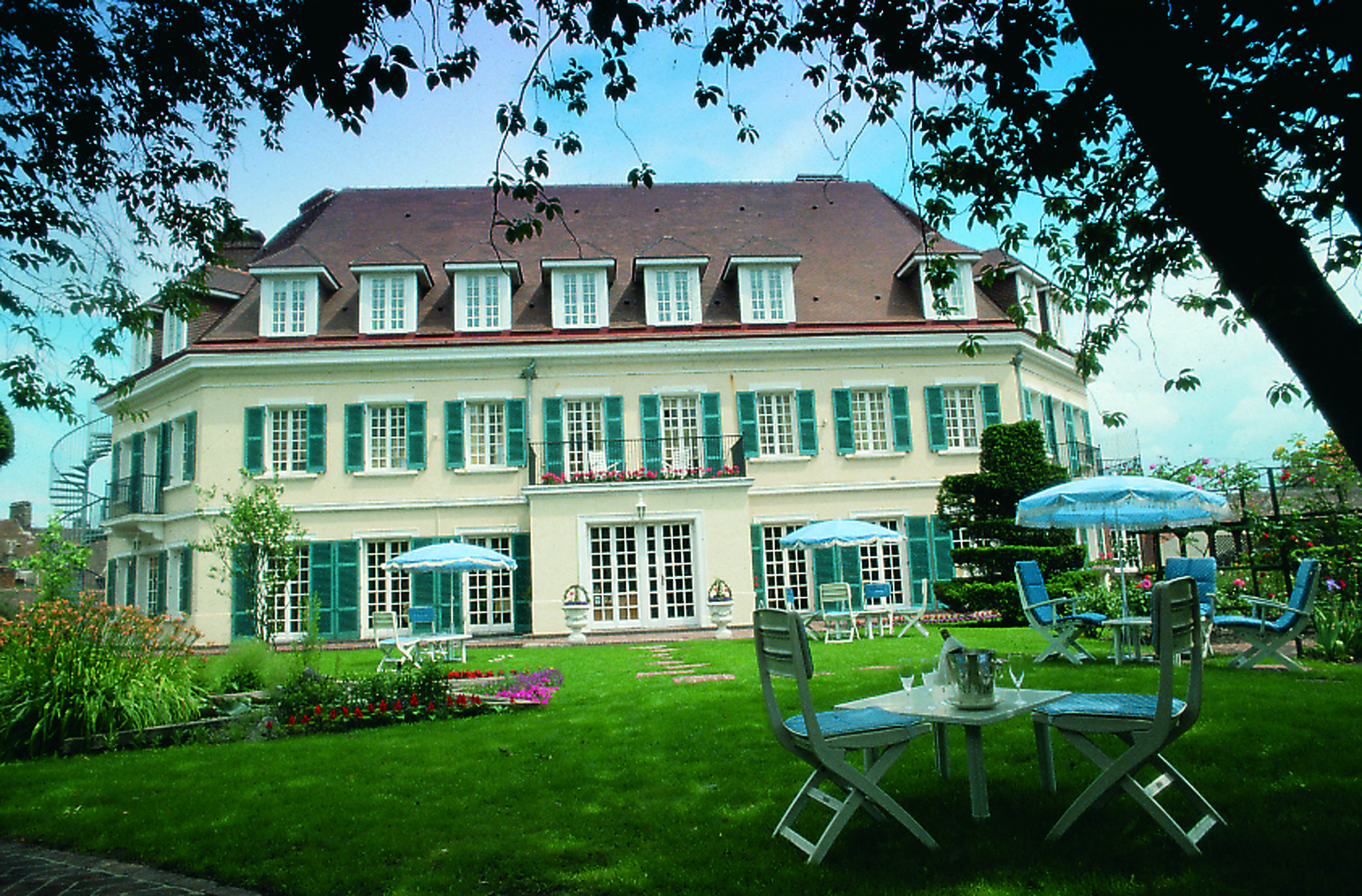Chateau de Montreuil Pas de Calais exterior white building with blue shutters and gardens