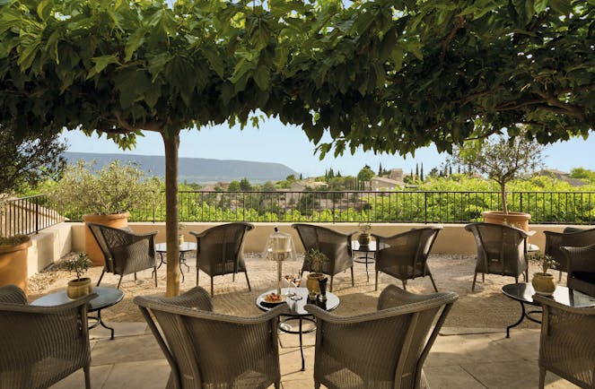 La Bastide de Gordes Provence terrace bar seating area wicker chairs and small tables