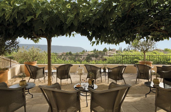 La Bastide de Gordes Provence terrace bar seating area wicker chairs and small tables