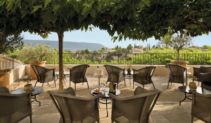 La Bastide de Gordes Provence terrace bar seating area wicker chairs and small tables