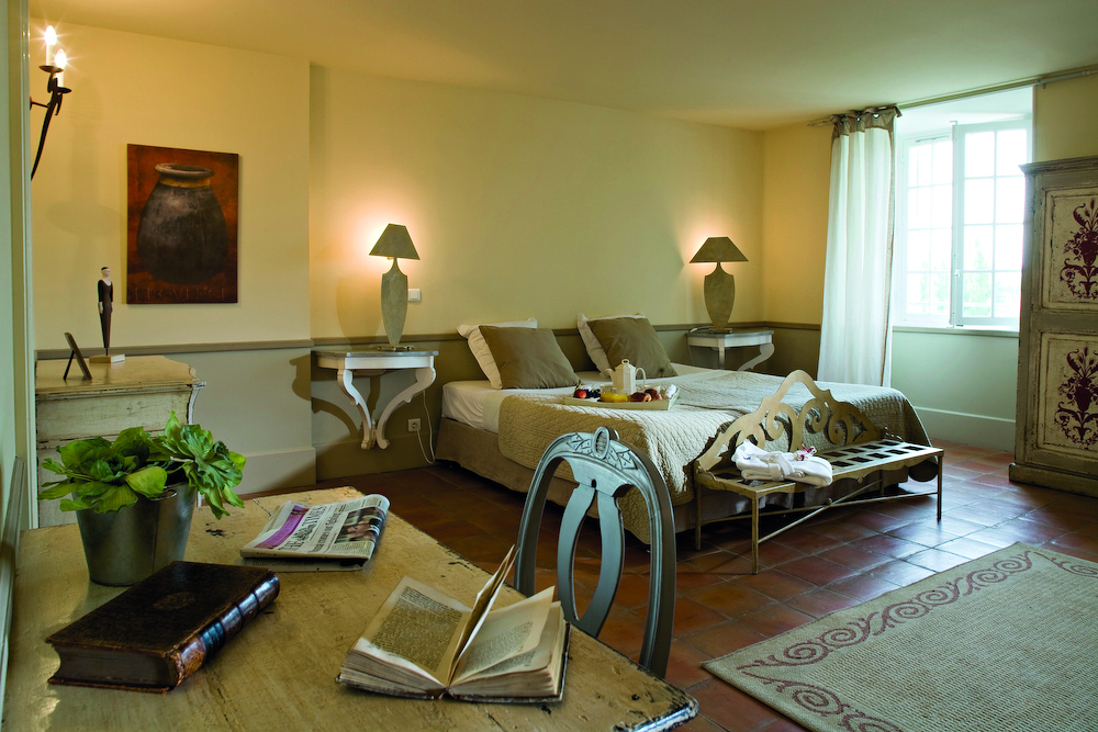 Chateau de Mazan Provence junior suite bedroom with desk and chair two bedside tables