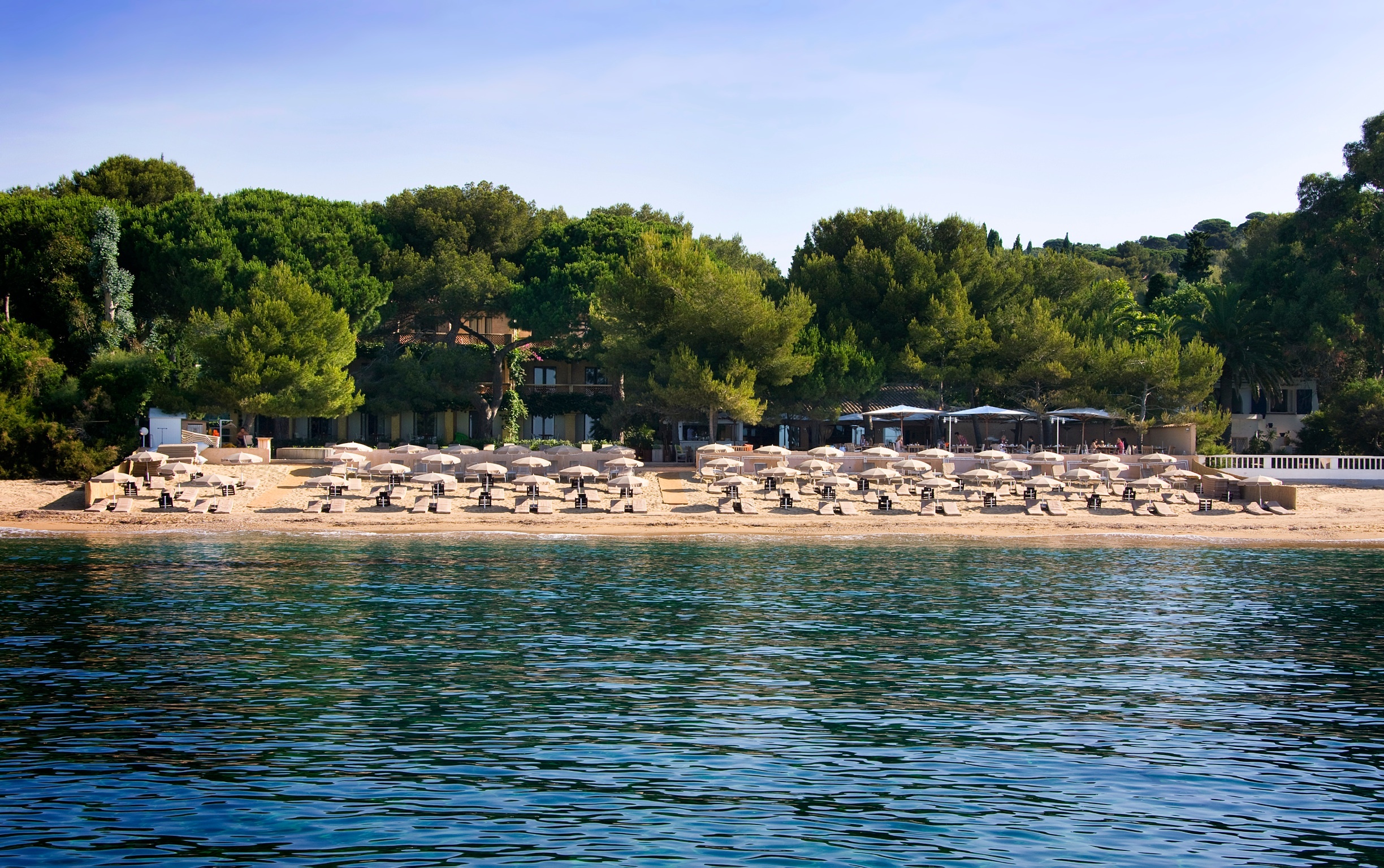 Chateau de Valmer beach with umbrellas