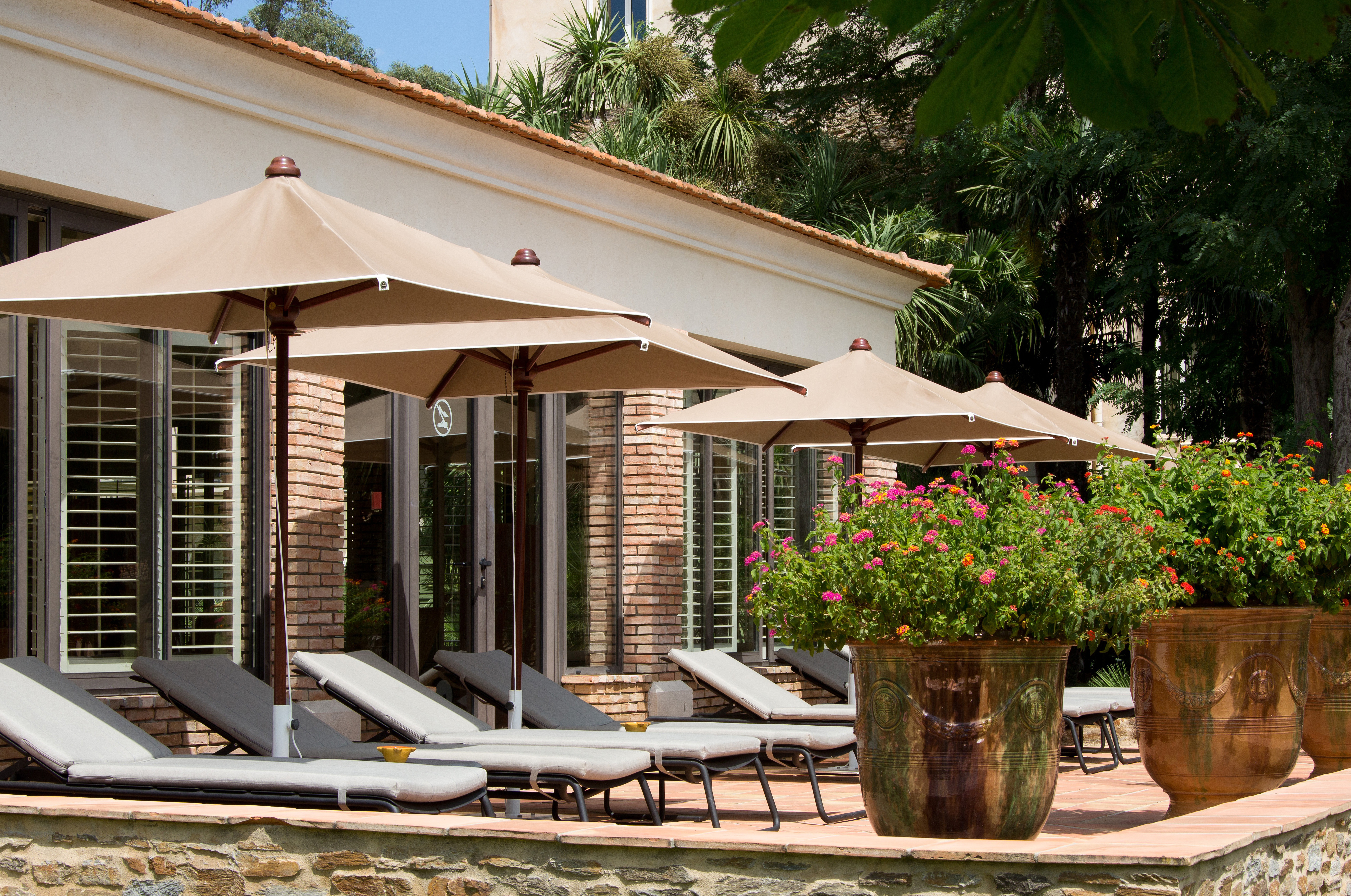Chateau de Valmer exterior with sunbeds