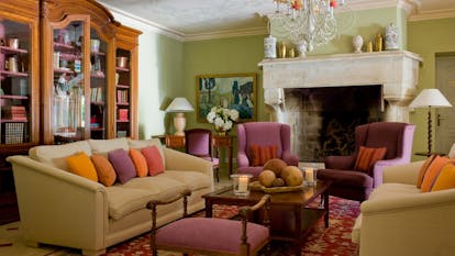 Chateau de Valmer comforable sofas and bright cushions in lounge