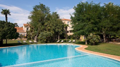 Chateau de Valmer blue water of freeform swimming pool