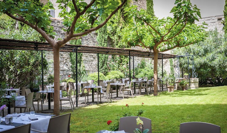 Le Cloitre Saint Louis Avignon secret garden covered outdoor dining area in walled garden