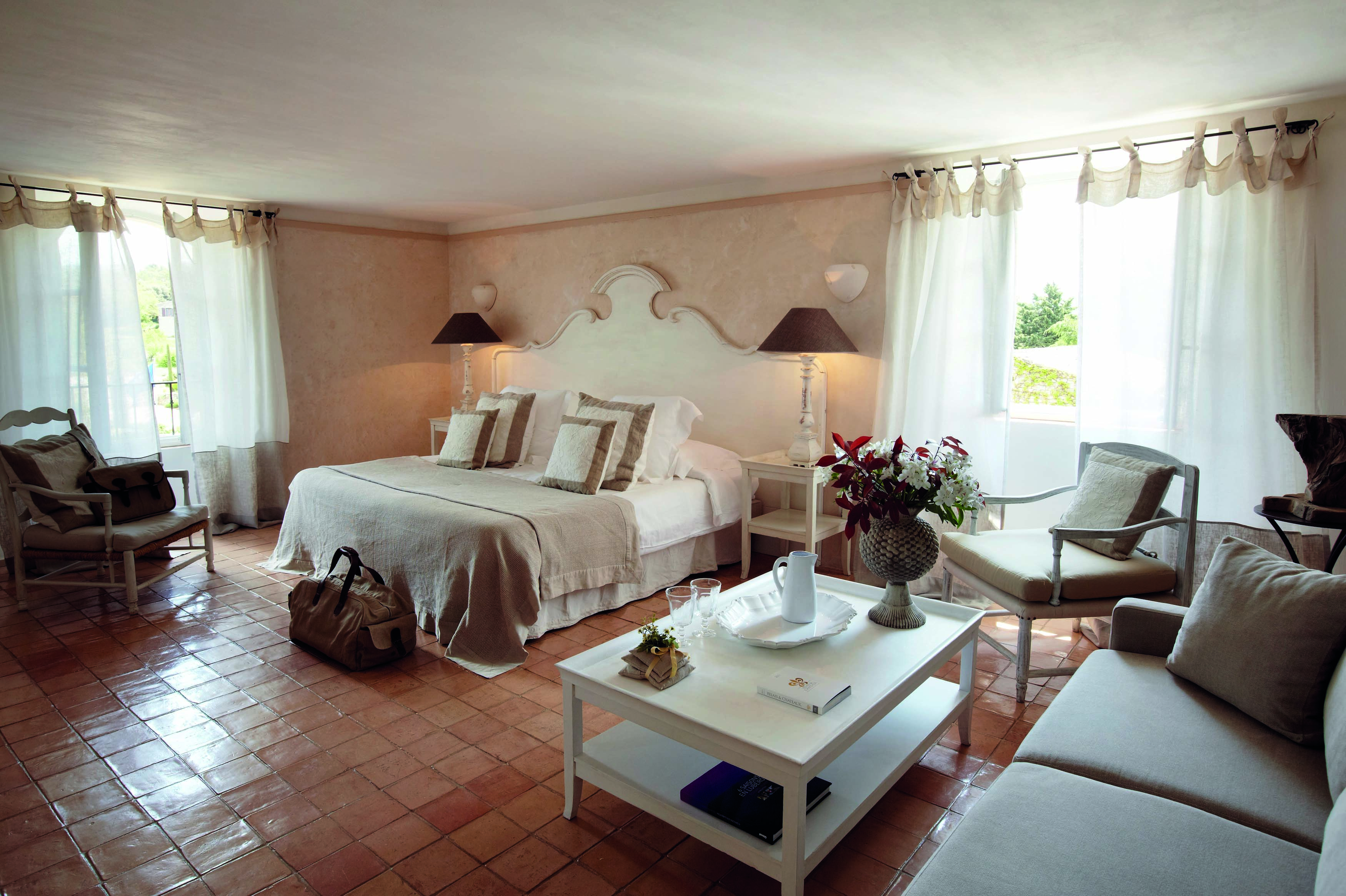Domaine de Capelongue Provence bedroom with sofa armchairs and coffee table