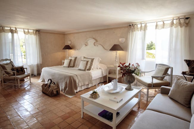 Domaine de Capelongue Provence bedroom with sofa armchairs and coffee table