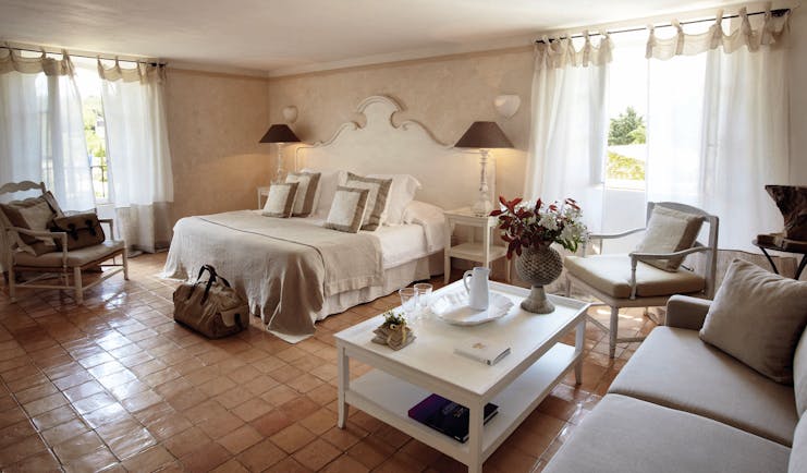 Domaine de Capelongue Provence bedroom with sofa armchairs and coffee table