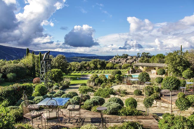 Domaine de Capelongue Provence exterior aerial terrace seating area topiary potted bushes and countryside views