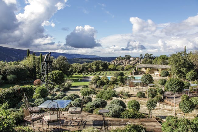 Domaine de Capelongue Provence exterior aerial terrace seating area topiary potted bushes and countryside views