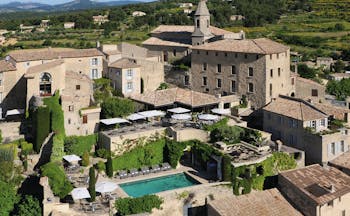 Hotel Crillon le Brave Provence aerial village view several buildings and an outdoor swimming pool