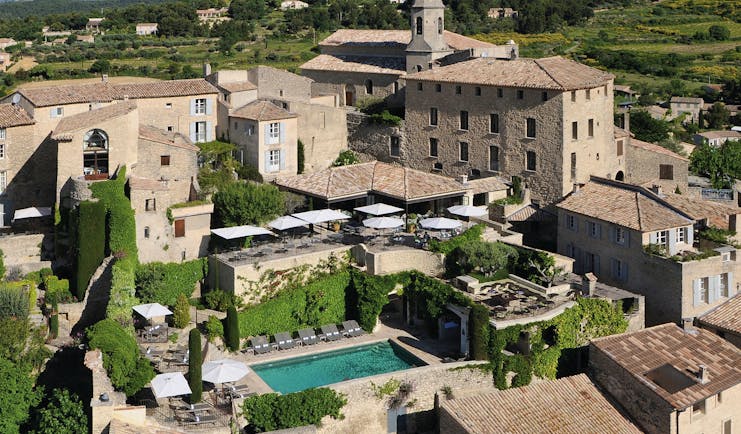 Hotel Crillon le Brave Provence aerial village view several buildings and an outdoor swimming pool