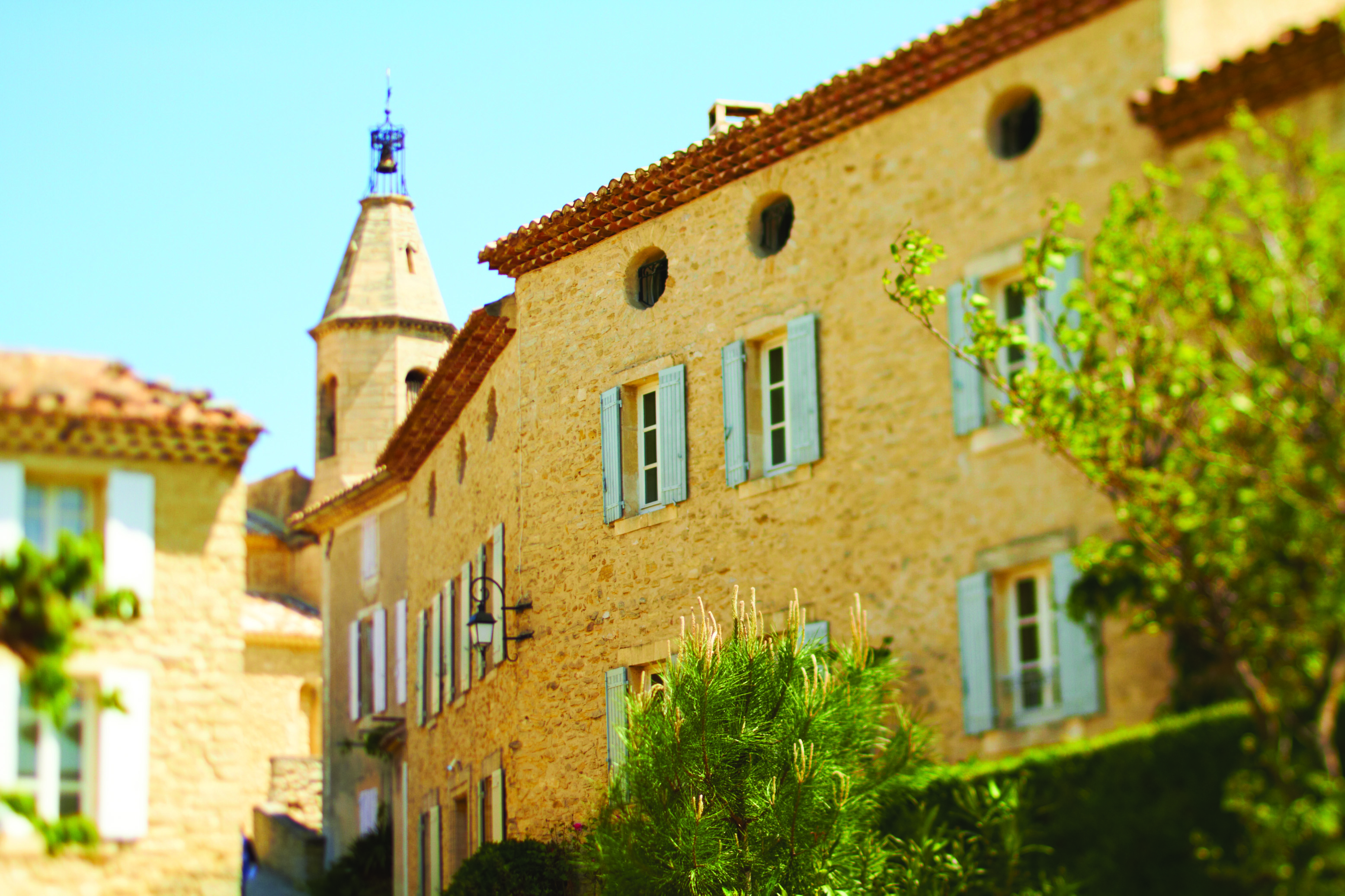 Hotel Crillon le Brave Provence exterior building yellow stone building round windows and shutters