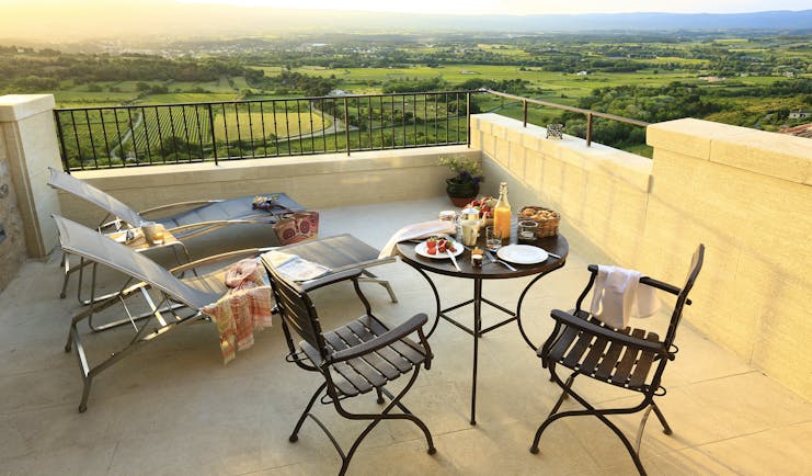 Hotel Crillon le Brave Provence patio terrace with sun loungers table with fruit and pastries 
