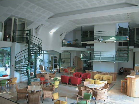 Lobby area with glass spiral stair cases and seating area