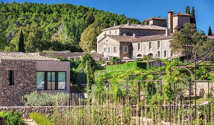 Chateau de Berne Provence exterior countryside large stone cottage on a tree covered hillside