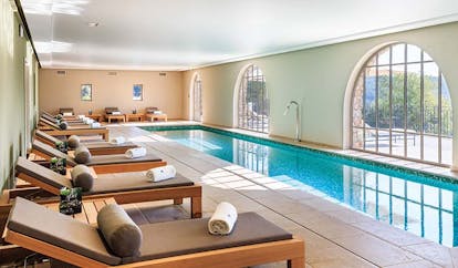 Chateau de Berne Provence indoor spa pool with wooden loungers