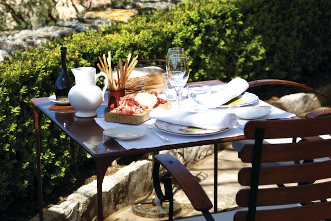 La Bastide de Moustiers Provence outdoor terrace table with bread and charcuterie