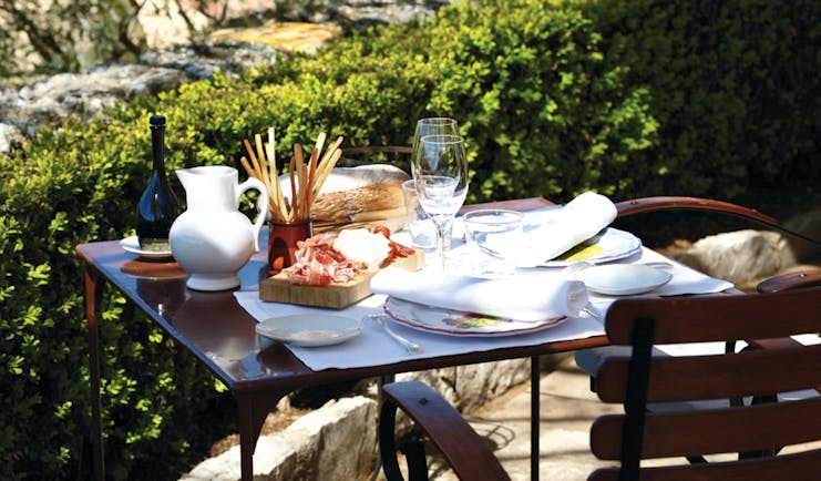 La Bastide de Moustiers Provence outdoor terrace table with bread and charcuterie