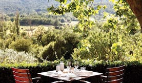 La Bastide de Moustiers Provence terrace dining area overlooking wooded area