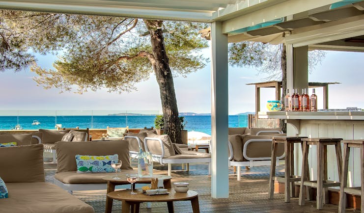Bar near beach open air with pale furniture at Pinede Plage