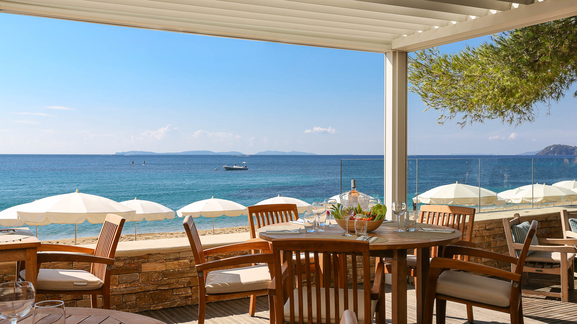 Terrace with chairs and tables over looking beach and sea at Pinede Plage