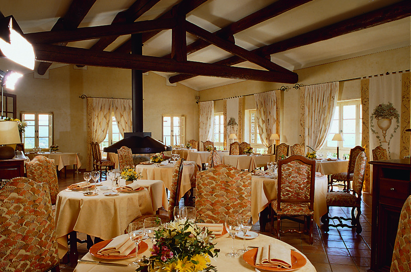 Indoor restaurant area with tables set up around the room 