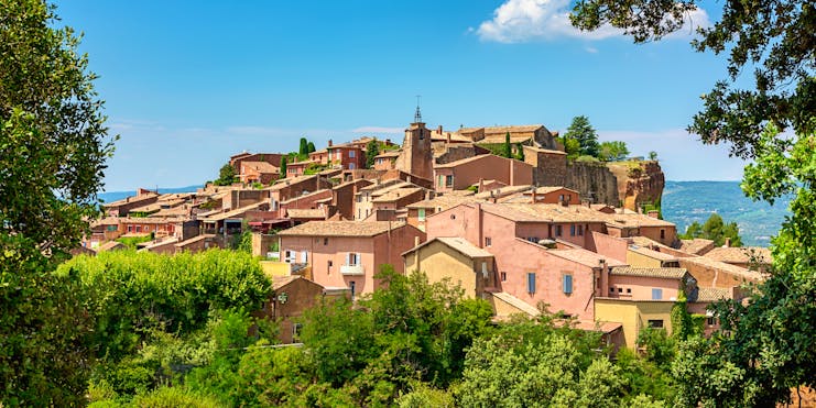 Pink-tinged houses on hill village of Roussillon in Luberon Provence