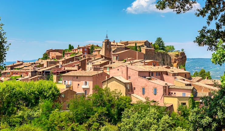 Pink-tinged houses on hill village of Roussillon in Luberon Provence