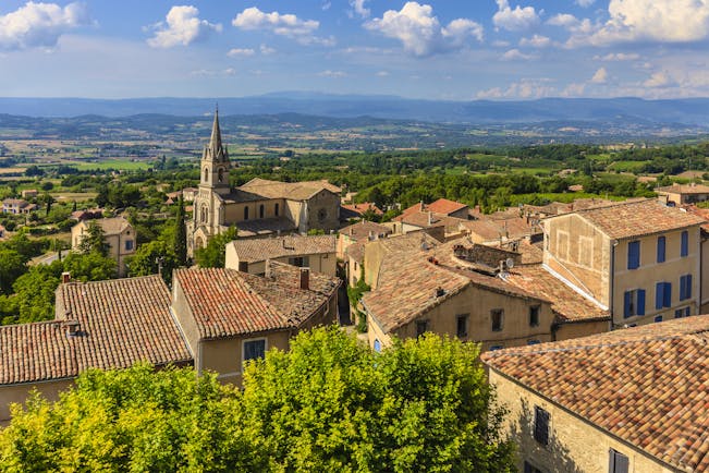 View of the houses of the Luberon village of Bonnieux with tiled roofs