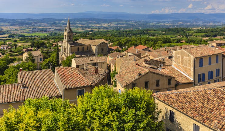 View of the houses of the Luberon village of Bonnieux with tiled roofs