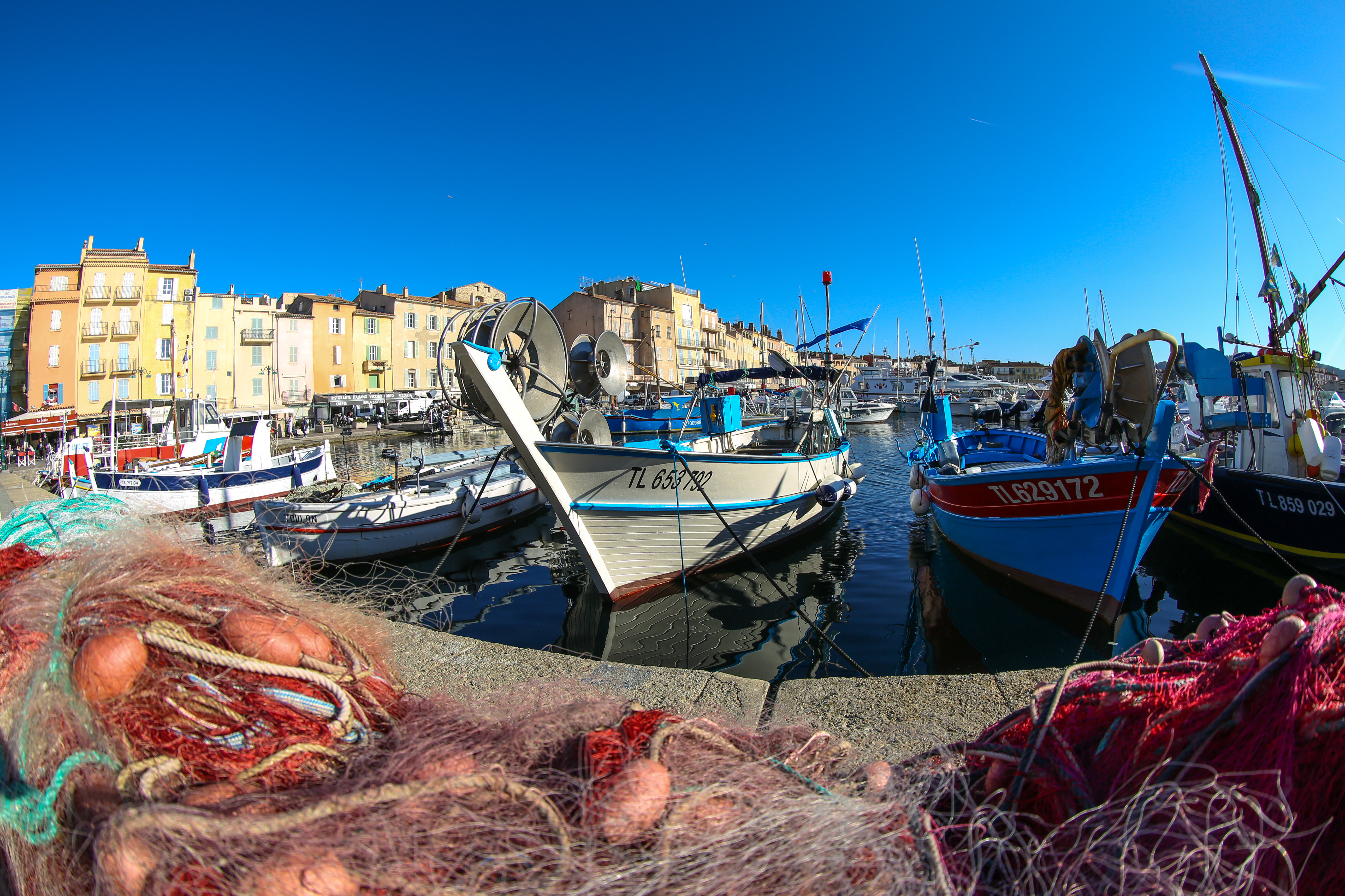 Fishing boats and nets on harbour side in St Trpoez