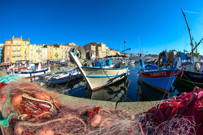 Fishing boats and nets on harbour side in St Trpoez