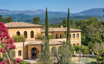 Terre Blanche Hotel and Spa Provence exterior large yellow building with arched windows and archways