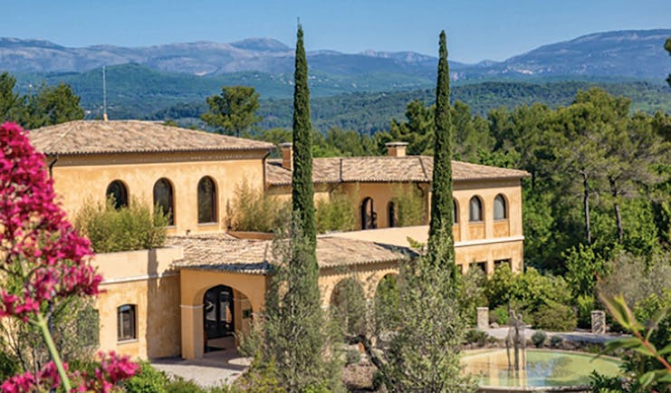 Terre Blanche Hotel and Spa Provence exterior large yellow building with arched windows and archways