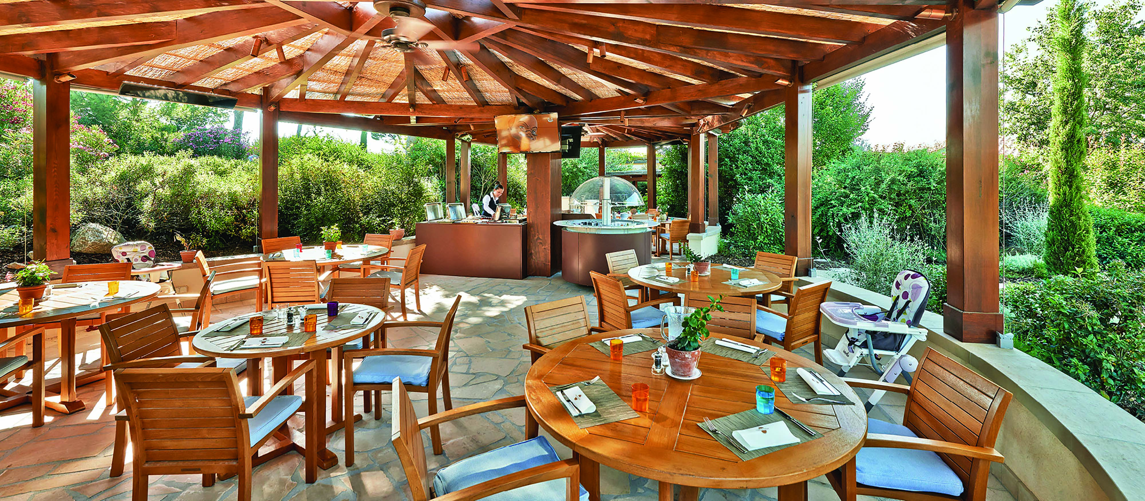 Terre Blanche Hotel and Spa Provence kids restaurant dining pagoda dining area with several tables and a high chair