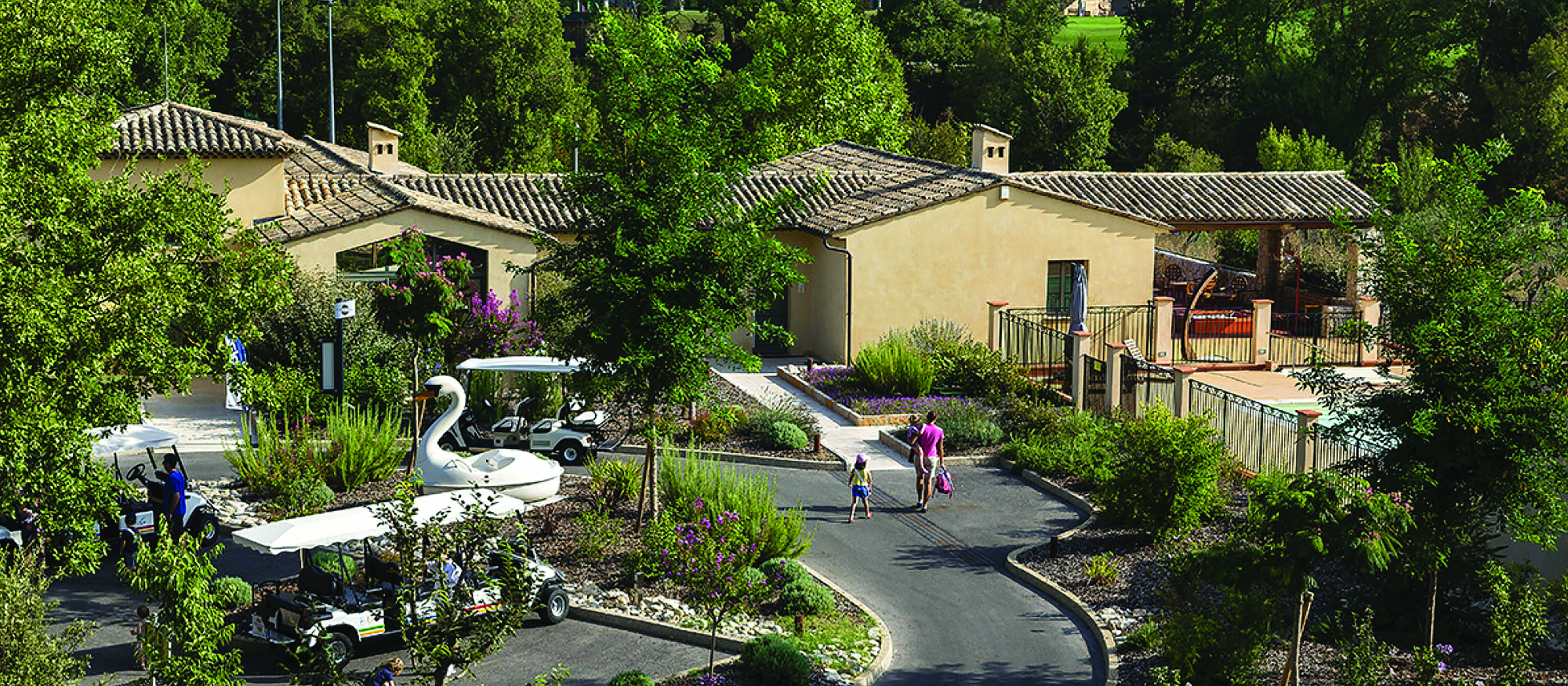 Terre Blanche Hotel and Spa Provence outdoor villa buildings and golf buggy