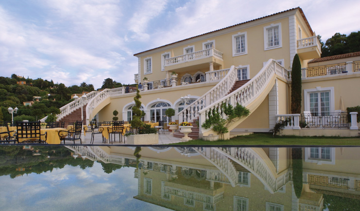 Althoff Villa Belrose Saint Tropez outdoor terrace yellow building balcony and stair cases and pool
