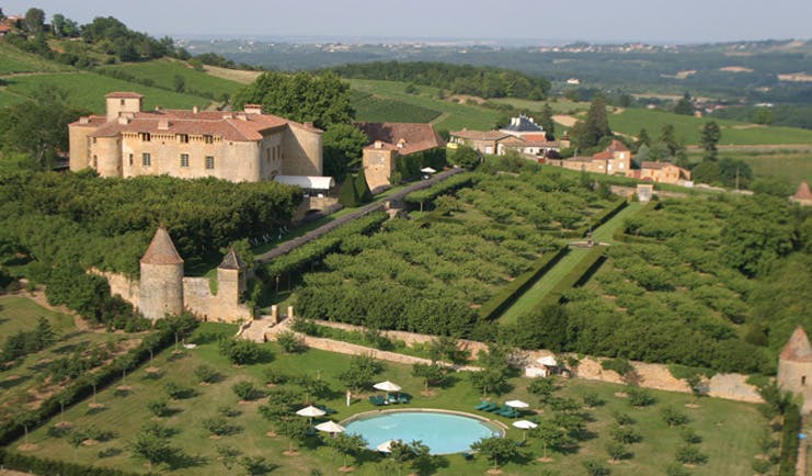 Chateau de Bagnols Rhone Valley aerial countryside view of castle with gardens and swimming pool