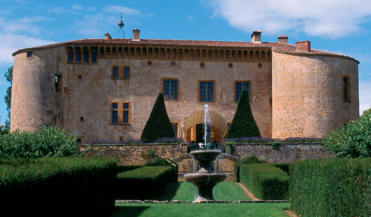Chateau de Bagnols Rhone Valley exterior castle overlooking lawned garden and fountain